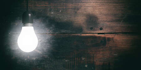 3d rendering light bulb hanging on wooden backgroundの写真素材
