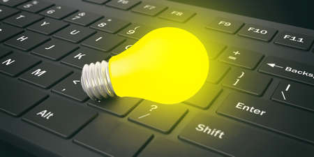 3d rendering yellow light bulb on a black keyboardの写真素材