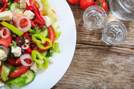 Fresh greek salad on wooden backgroundの写真素材