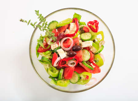 Fresh greek salad on white backgroundの写真素材