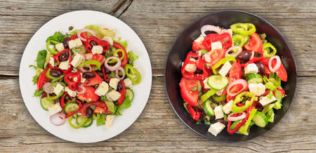 Fresh greek salad on wooden backgroundの写真素材