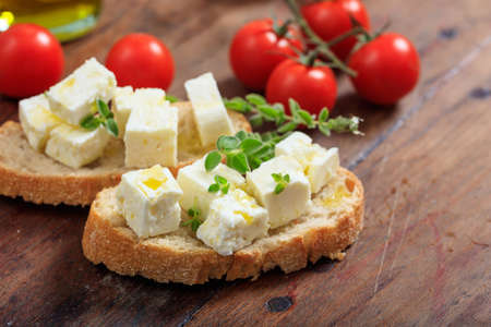 Greek feta cheese pieces on wooden backgroundの写真素材