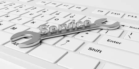 3d rendering spanner on a white keyboardの写真素材