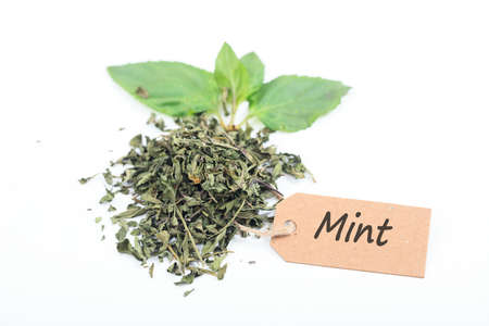 Fresh and dried mint with label on white backgroundの写真素材