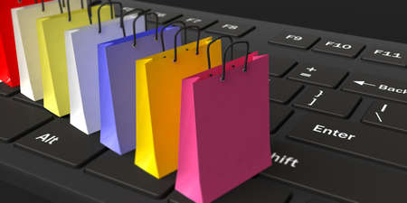 3d rendering shopping bags on a black keyboardの写真素材