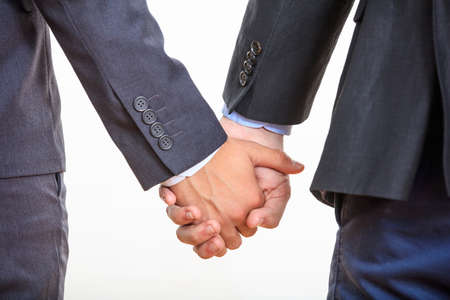 two men holding hands