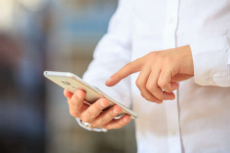 Businessman holding a mobile phoneの写真素材