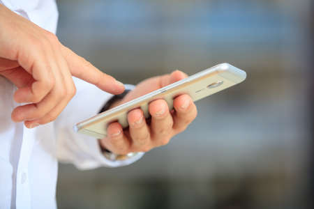 Businessman holding a mobile phoneの写真素材