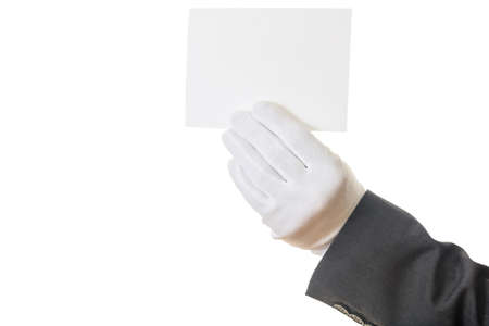 Gloved hand holding a blank paperの写真素材