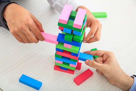 Hands playing wooden blocks gameの写真素材