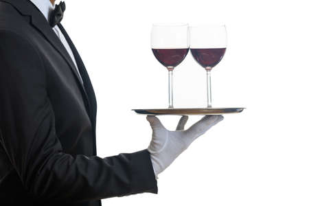 Waiter holding a tray with wine glassesの写真素材
