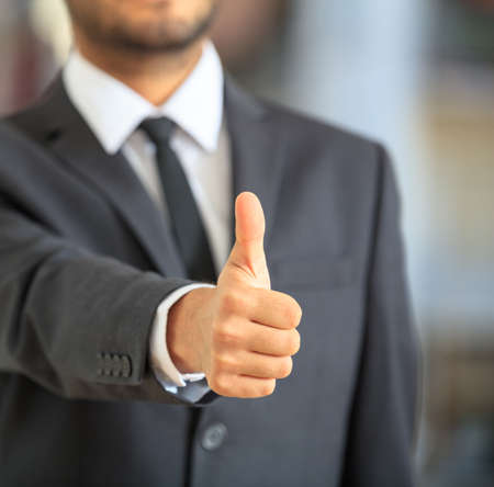 Man in suit making a gestureの写真素材