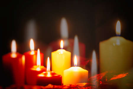 Red and white candles on a dark backgroundの写真素材