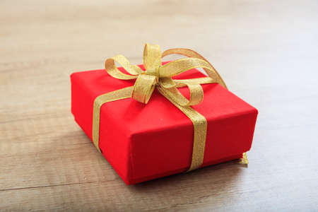 Red gift box on wooden backgroundの写真素材