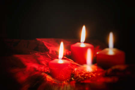 Red candles on a dark backgroundの写真素材