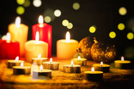 White and red candles on a dark backgroundの写真素材