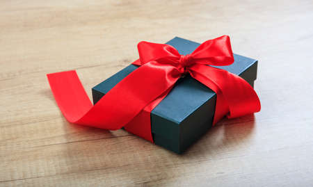 Blue gift box on wooden backgroundの写真素材