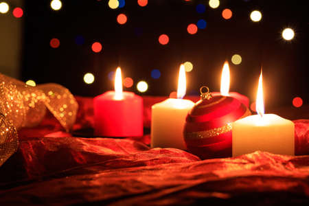White and red candles on a dark backgroundの写真素材