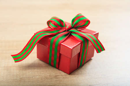 Red gift box on wooden backgroundの写真素材