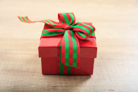 Red gift box on wooden backgroundの写真素材
