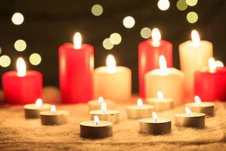 White and red candles on a dark backgroundの写真素材