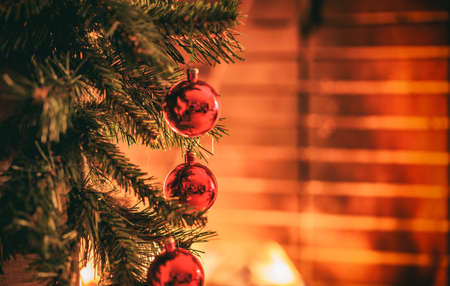 Christmas tree near a fireplaceの写真素材