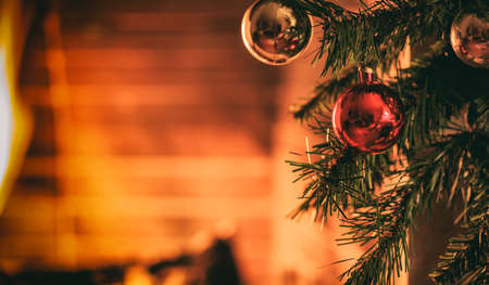 Christmas tree near a fireplaceの写真素材