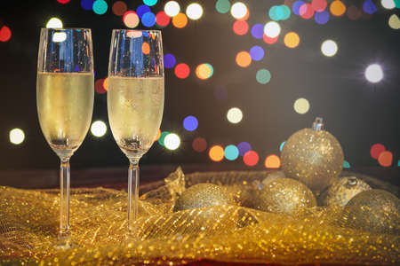 Two glasses of champagne and christmas decorationの写真素材