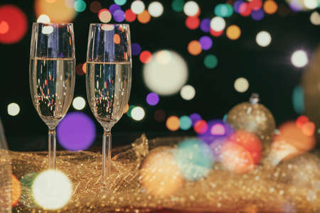 Two glasses of champagne and christmas decorationの写真素材