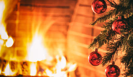 Christmas tree near a fireplaceの写真素材