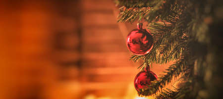 Christmas tree near a fireplaceの写真素材