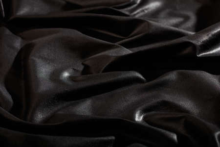 Black satin textile full backgroundの写真素材