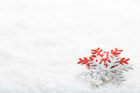 Shinny snow flakes on snow backgroundの写真素材