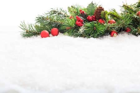 Christmas decoration on snow with copy spaceの写真素材
