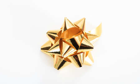 Golden bow isolated on white backgroundの写真素材