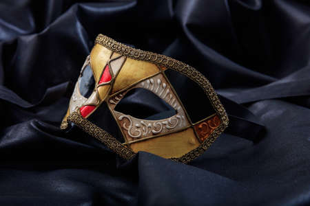Carnival mask isolated on black satin backgroundの写真素材