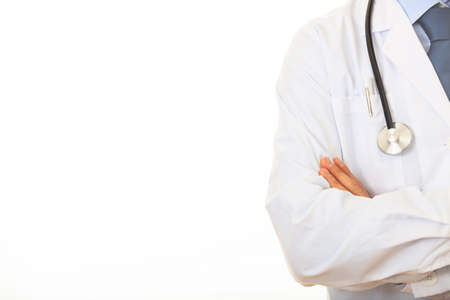 Doctor with a stethoscope standing on white backgroundの写真素材
