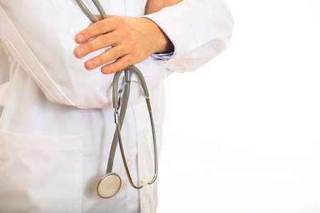 Doctor holding a stethoscope on white backgroundの写真素材