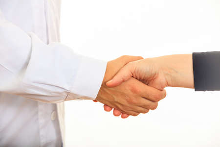 Doctor giving a handshake on white backgroundの写真素材