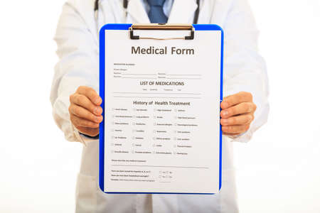 Doctor holding a blue clipboard on white backgroundの写真素材