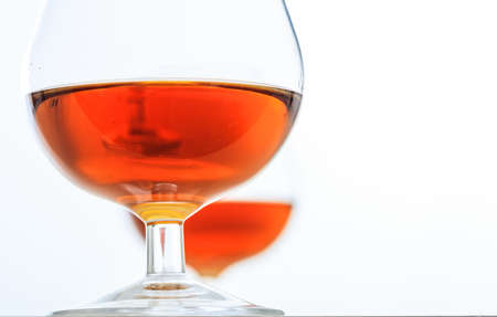Two crystal cognac glasses on white background