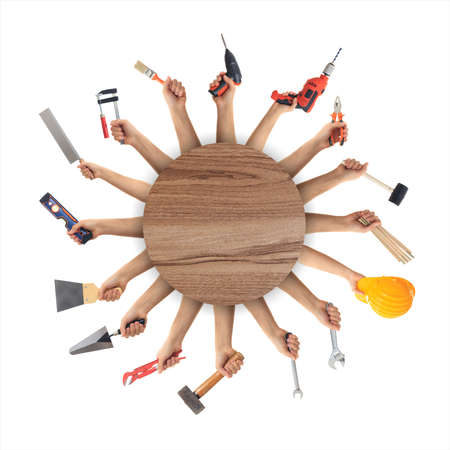 Hands holding hand tools on white backgroundの写真素材