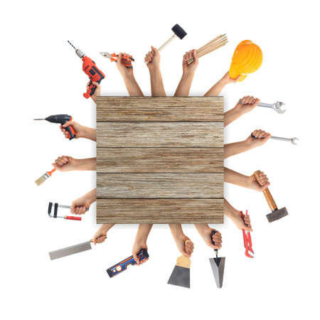 Hands holding hand tools on white backgroundの写真素材