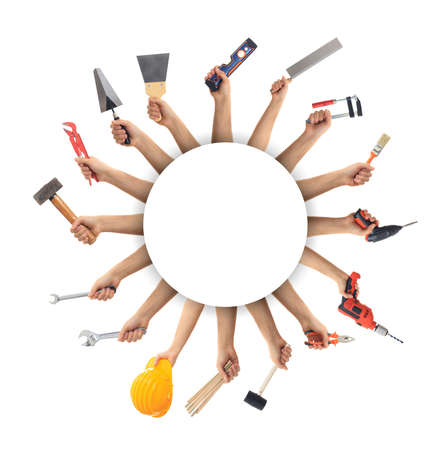 Hands holding hand tools on white backgroundの写真素材