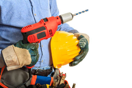 Worker holding an electric drill on white backgroundの写真素材