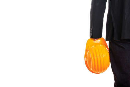 Engineer holding a hard hat on white backgroundの写真素材
