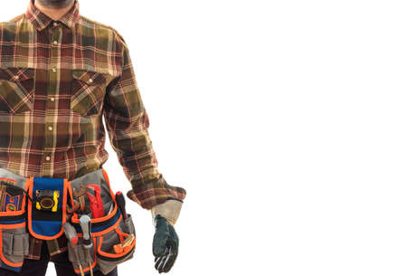 Worker with a tool belt on white backgroundの写真素材