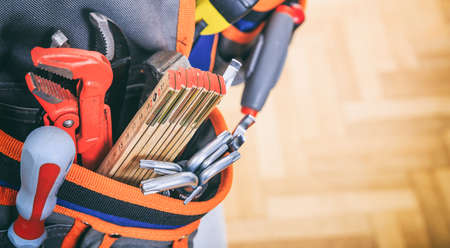 Tool belt close up on wooden backgroundの写真素材