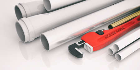 Red monkey wrench and pipes isolated on white background. 3d illustrationの写真素材