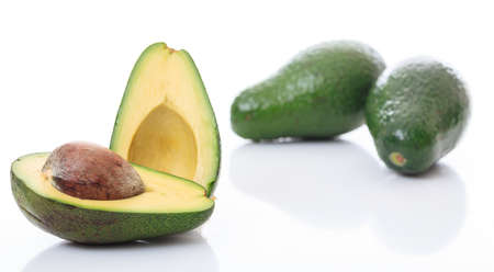 Avocados close up isolated on white backgroundの写真素材